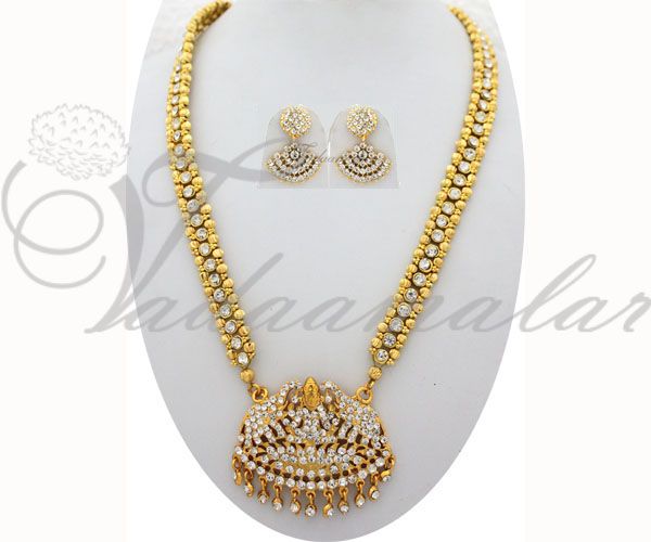 Long necklace with dazling white stones pendent is engraved with Goddess lakshmi with earrings