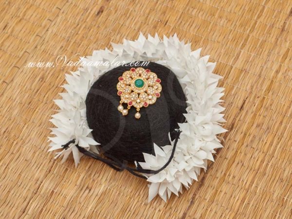 Indian Bridal Hair Design Band Bun with Multi ColorJewellery and White Flower Buy Now